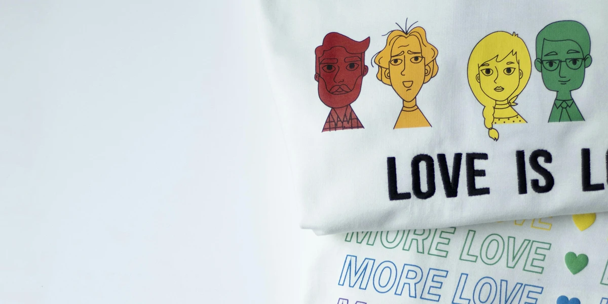 White graphic t-shirts on white table