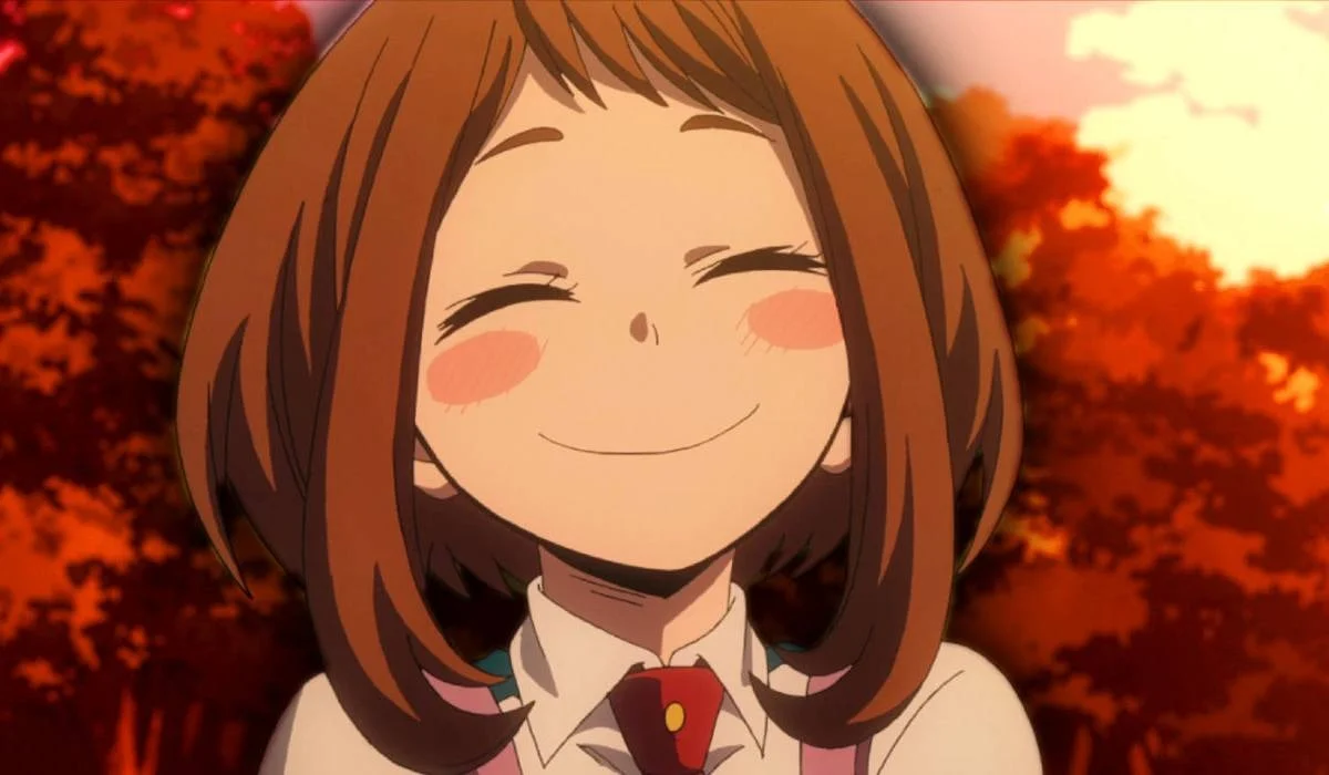 Ochaco Uraraka smiling with eyes closed in front of autumn trees