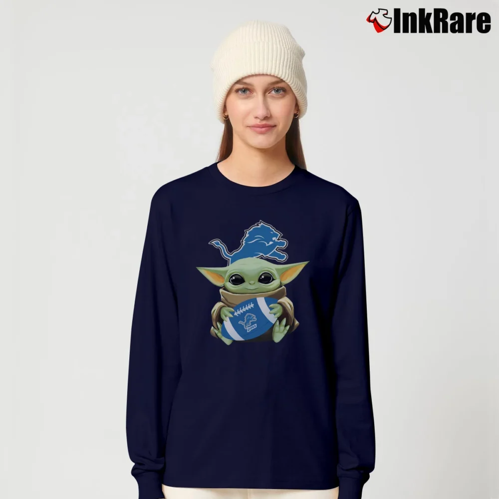Women’s Baby Yoda Hugs Detroit Lions Football Mandalorian Long-Sleeve Top in navy | Sleek, Versatile, All-Season