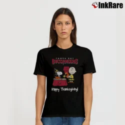 Women’s Charlie Brown And Snoopy Tampa Bay Buccaneers Football Happy Thanksgiving T-Shirt in black | Soft, Flattering Fit
