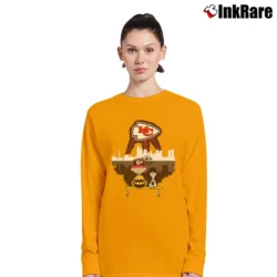 Women’s Charlie Brown And Snoopy Watching Kansas City Chiefs Long-Sleeve Top in orange | Sleek, Versatile, All-Season