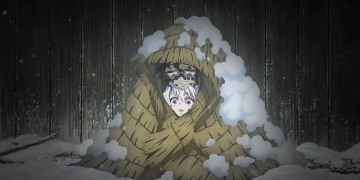 Young Daki and Gyutaro huddled together under a straw cloak in the snow