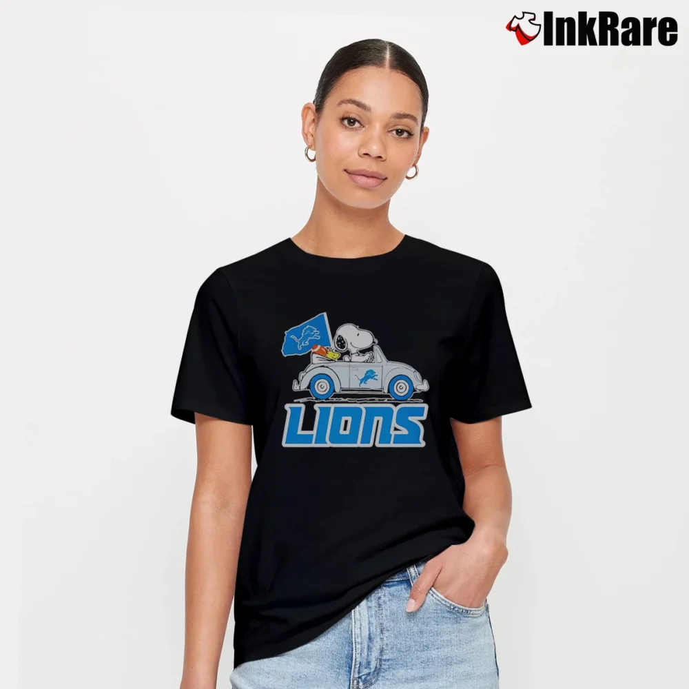 Women’s detroit lions snoopy driving car with flag T-Shirt in black | Soft, Flattering Fit