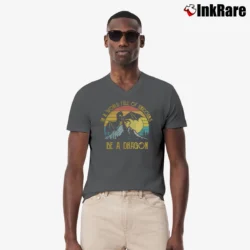 Men’s In A World Full Of Unicorns Be A Dragon Sunset V-Neck Tee in charcoal | Sharp, Breathable, Everyday Staple