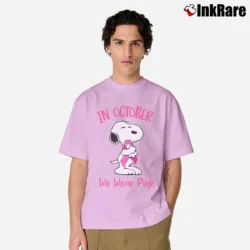 Men’s In October We Wear Pink Snoopy Breast Cancer Classic T-Shirt in light pink | Soft, Breathable Everyday Wear