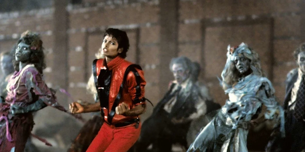 Michael Jackson performing the famous Thriller dance sequence with zombie dancers in the groundbreaking music video