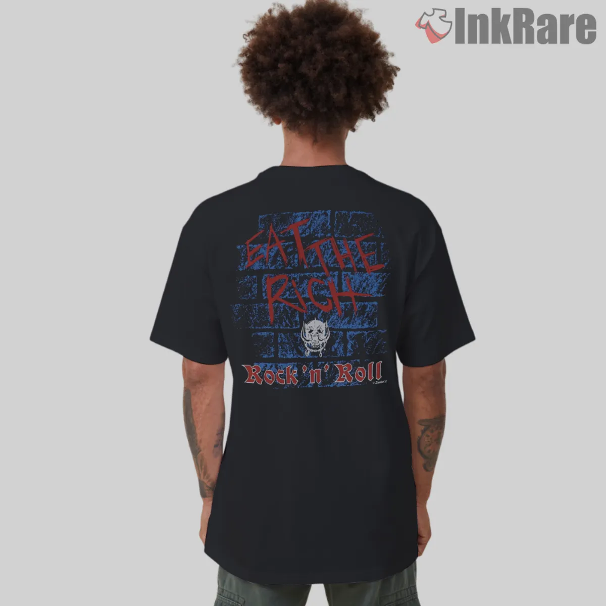 Eat The Rich Back Print Back view with blue brick texture and red graffiti text