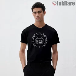 No Sleep Till Brooklyn Vintage Circle Emblem Shirt on black v-neck shirt for men graphic tee