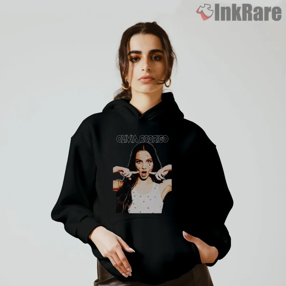 Olivia Rodrigo Confetti Face Playful Expression Shirt on black hoodie for women graphic tee