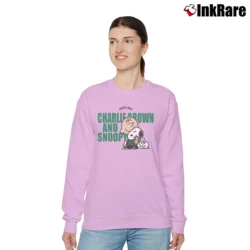 Women’s Peanuts Charlie Brown And Snoopy Relaxed Sweatshirt in light pink | Soft, Laid-Back Vibe