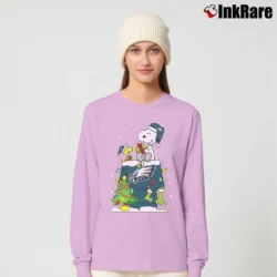 Women’s Philadelphia Eagles Snoopy Christmas Ugly Long-Sleeve Top in light pink | Sleek, Versatile, All-Season