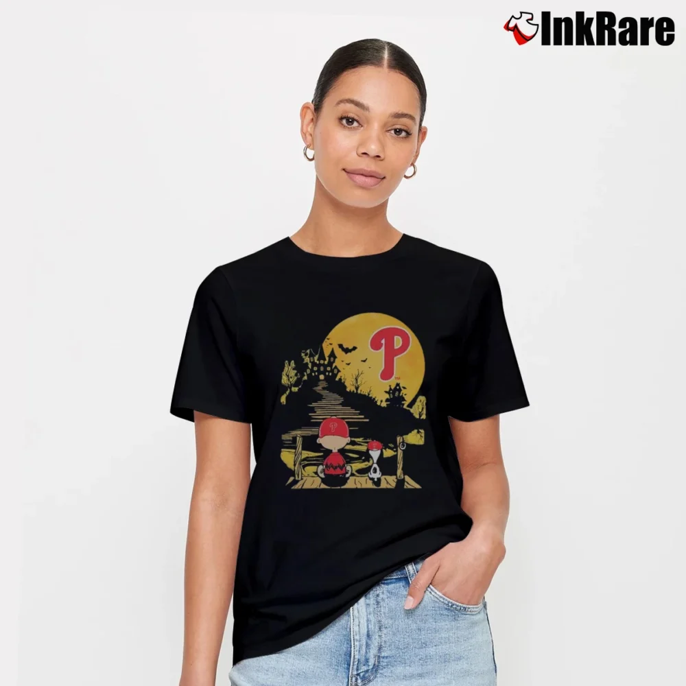 Women’s Philadelphia Phillies Snoopy And Charlie Brown Pumpkin Halloween Moon T-Shirt in black | Soft, Flattering Fit