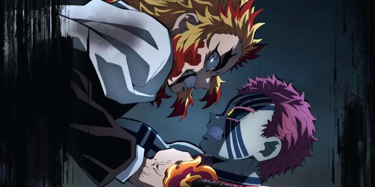 Rengoku staring Akaza in the eyes while his flaming sword pierces the demon's torso