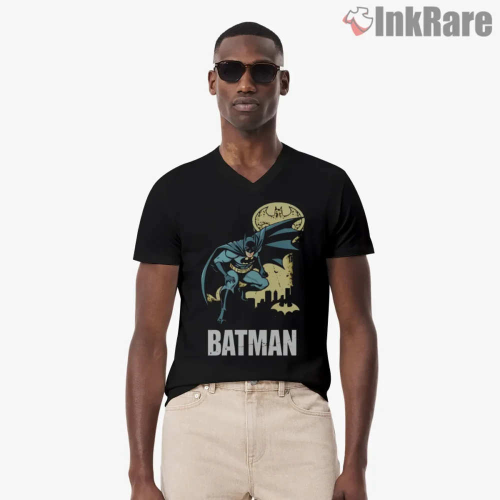 Retro Batman Leaping Over Gotham Shirt on black v-neck shirt for men graphic tee