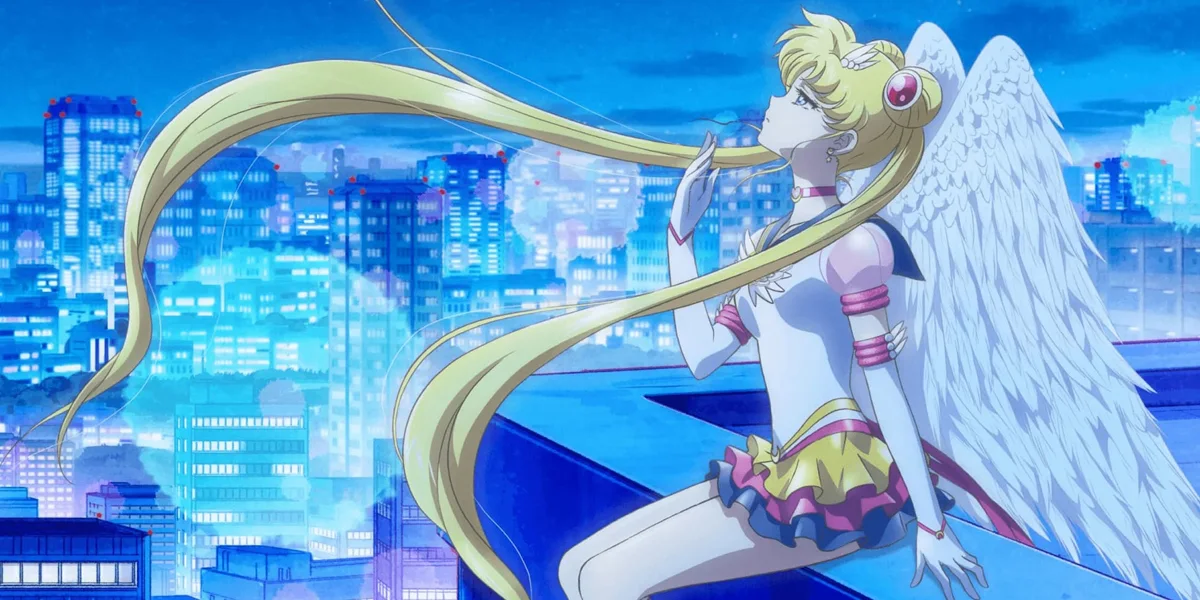 Sailor Moon sitting quietly above the city at night, representing comfort and reflection