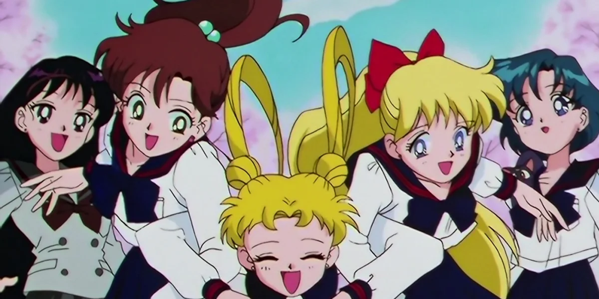 The Sailor Scouts smiling together in school uniforms, reflecting friendship and balance beyond battle