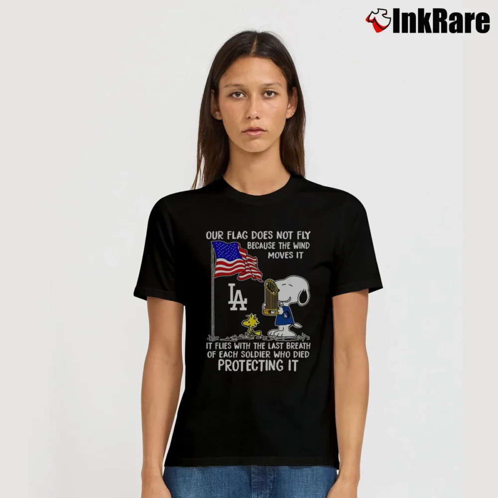 Women’s Snoopy And Woodstock Our Flag Does Not Fly Because The Wind Moves It It Flies With The Last Breath Los Angeles Dodgers T-Shirt in black | Soft, Flattering Fit