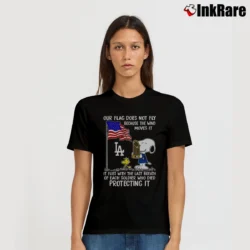 Women’s Snoopy And Woodstock Our Flag Does Not Fly Because The Wind Moves It It Flies With The Last Breath Los Angeles Dodgers T-Shirt in black | Soft, Flattering Fit