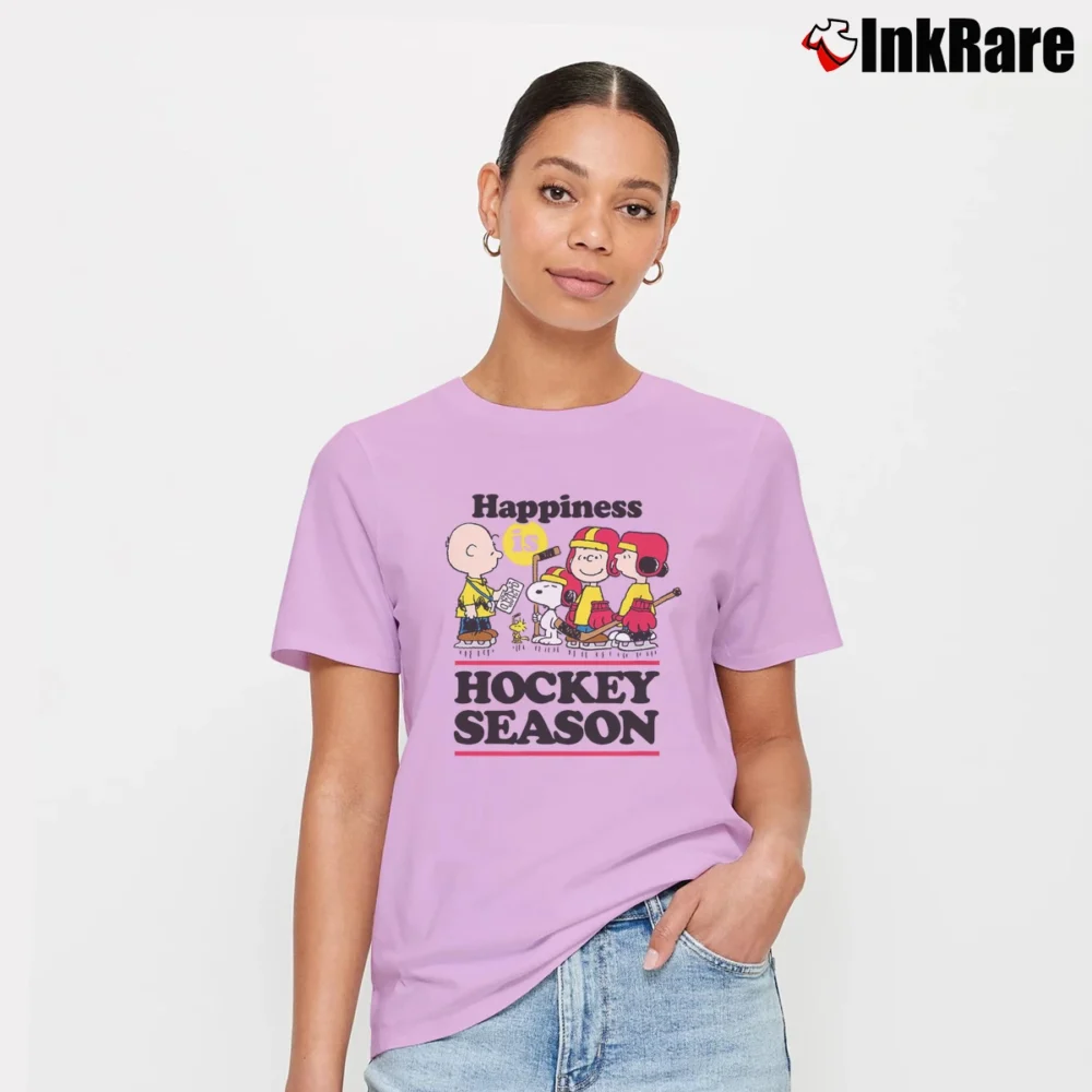 Women’s Snoopy Happiness Is Hockey Season Peanuts Signature T-Shirt in light pink | Soft, Flattering Fit