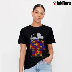 Women’s Snoopy Sleeping On His Dog House Puzzle Pieces Shape T-Shirt in black | Soft, Flattering Fit
