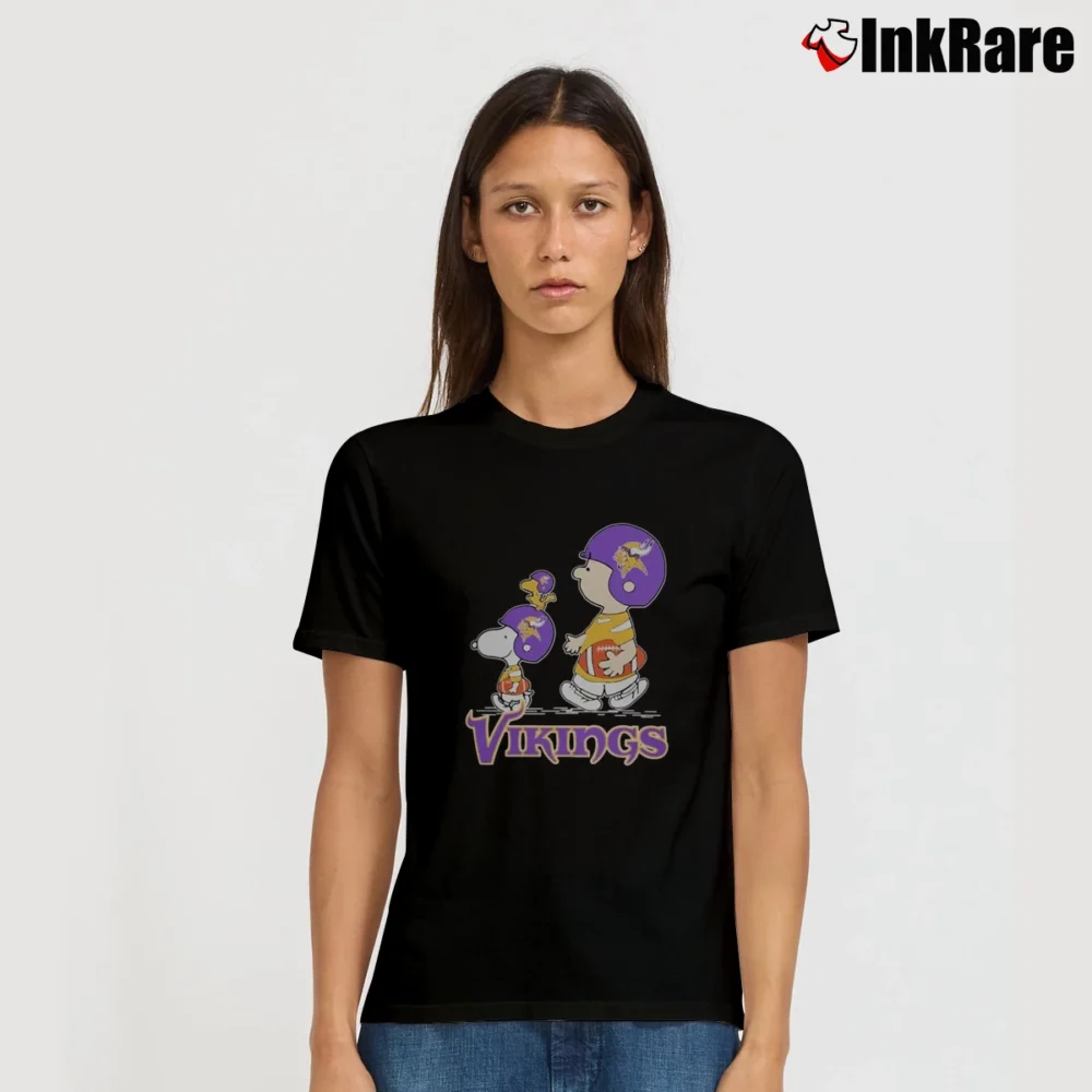 Women’s Snoopy Woodstock Charlie Brown Minnesota Vikings Football T-Shirt in black | Soft, Flattering Fit