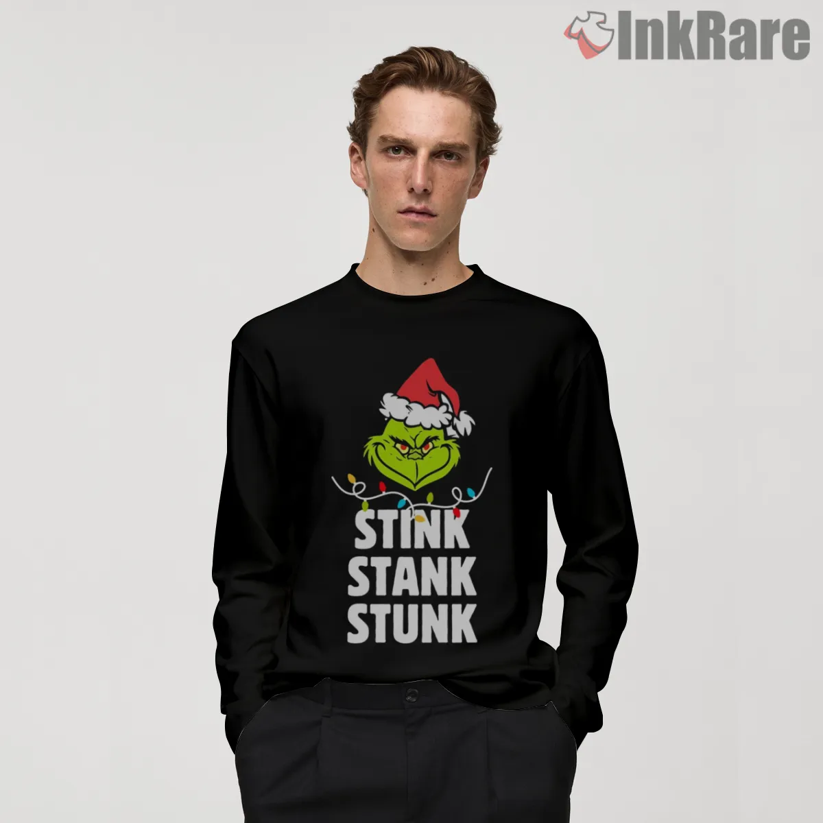 Stink Stank Stunk Grinch Lights Shirt on black long sleeve shirt for men graphic tee
