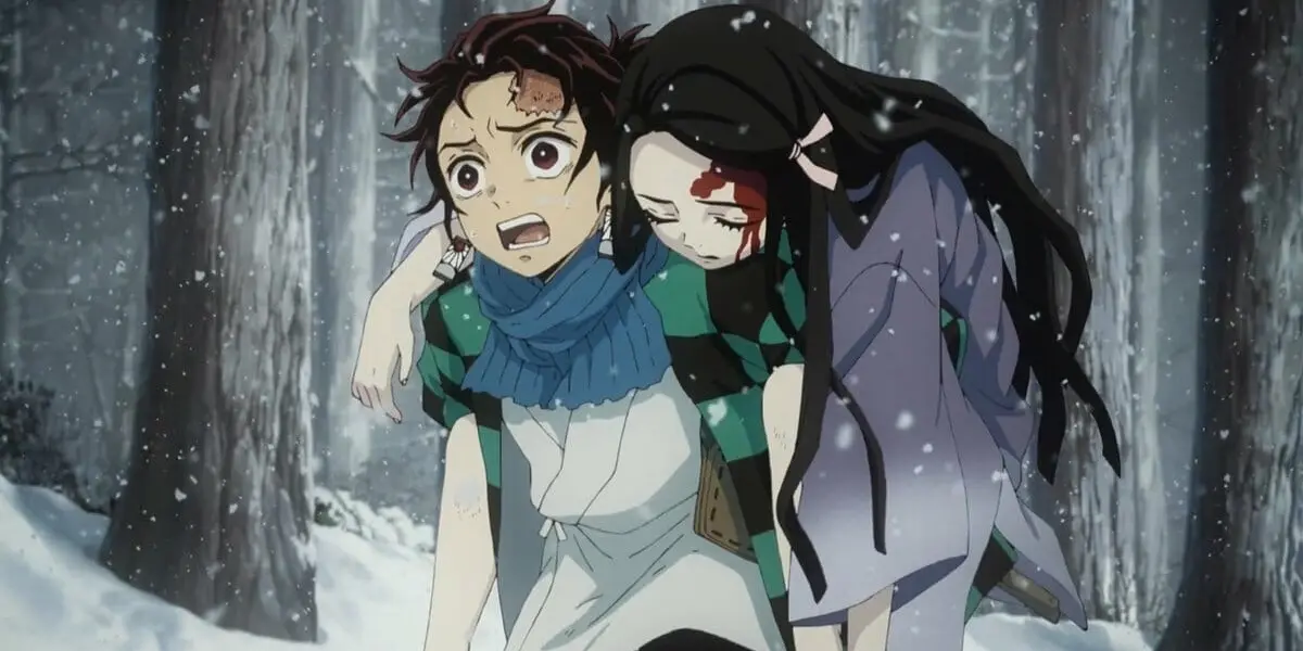 Tanjiro carrying an injured Nezuko through a snowy forest after their family is killed