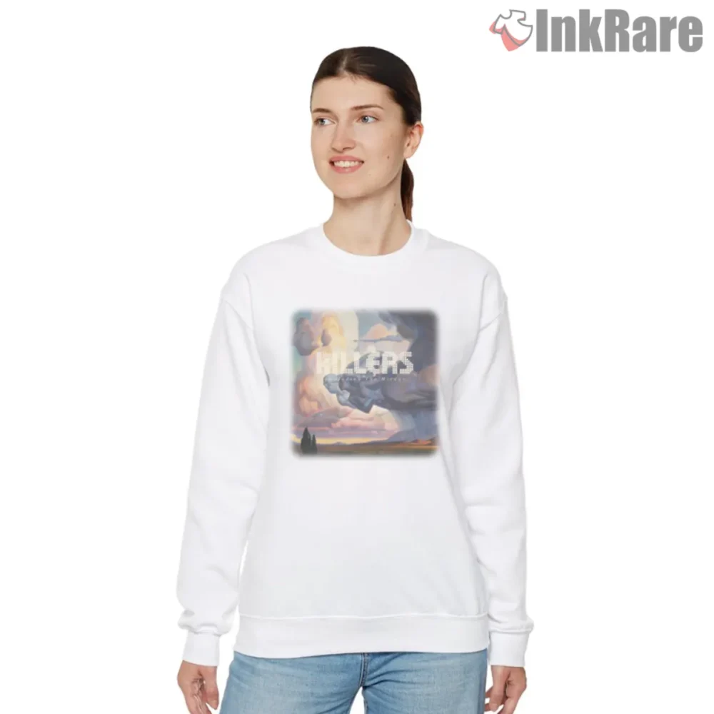 White women sweatshirt featuring The Killers Imploding the Mirage album art with pastel cloudscape and figures