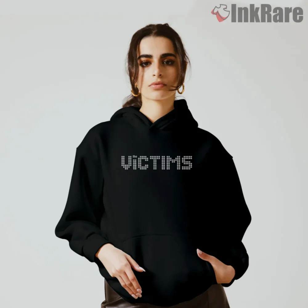 The Killers Victims Shirt with dotted marquee wordmark on a black hoodie