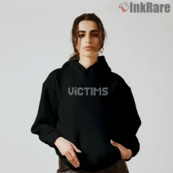 The Killers Victims Shirt with dotted marquee wordmark on a black hoodie