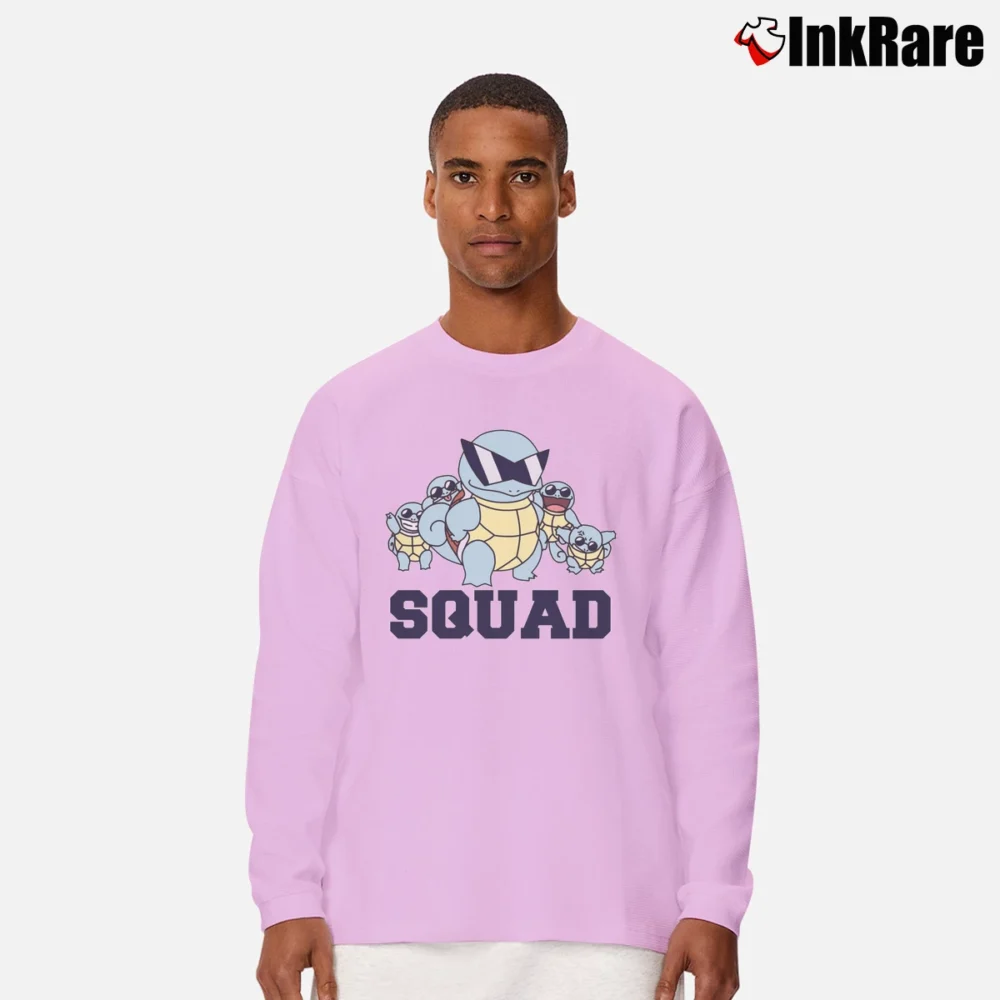 Men’s The Squirtle Squad Pokemon Go Graphic Long-Sleeve Shirt in light pink | Sleek, Lightweight, Year-Round Wear